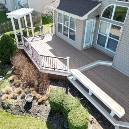 Overhead view of completed low-maintenance Trex Lineage deck in Algonquin with built-in bench, custom pergola, and clean white trim detailing.