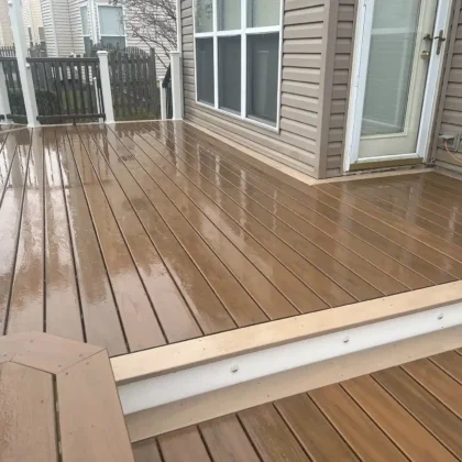 Close-up view of newly resurfaced Trex Lineage decking in Algonquin showing smooth, water-resistant finish and clean white trim along the edge.