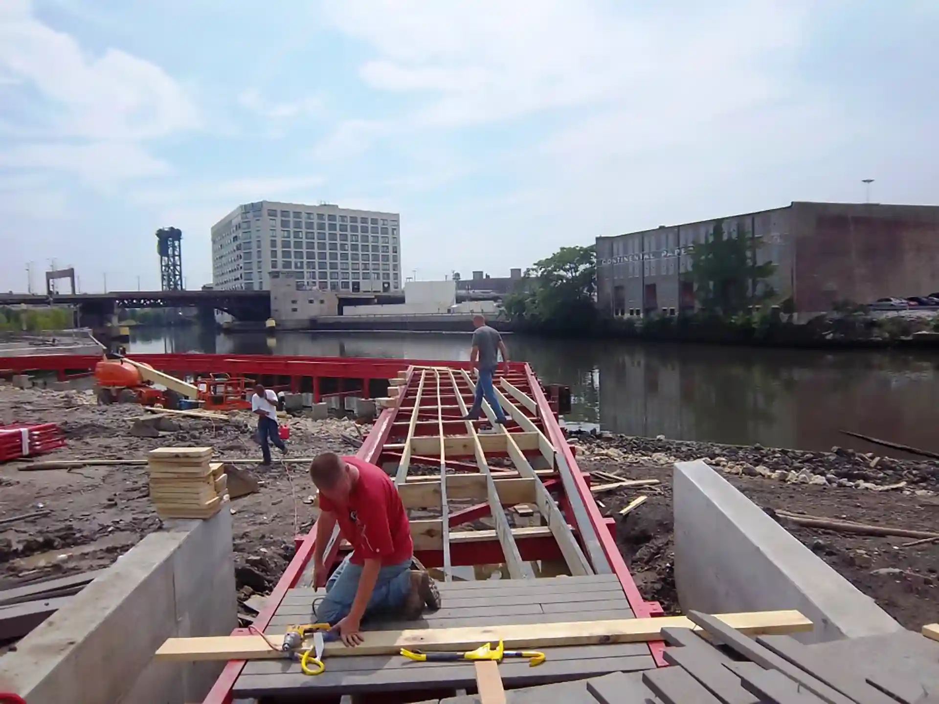 American Deck Builders crews building a walkway in a park area and over water as part of a municipal park project
