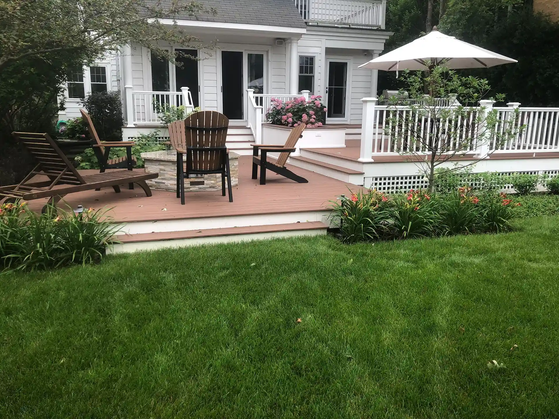 PHoto of a multi-level deck with a back porch area
